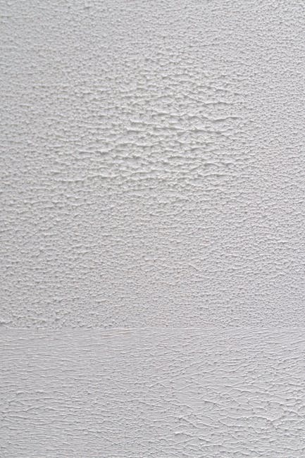 Close-up of a white textured wall, perfect for backgrounds or artistic projects.