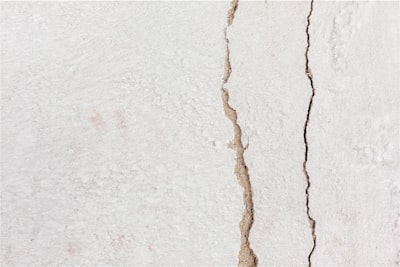 a crack in the side of a white wall